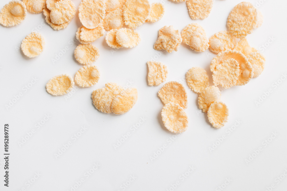 Round frame of delicious crispy cornflakes on white background, healthy breakfast