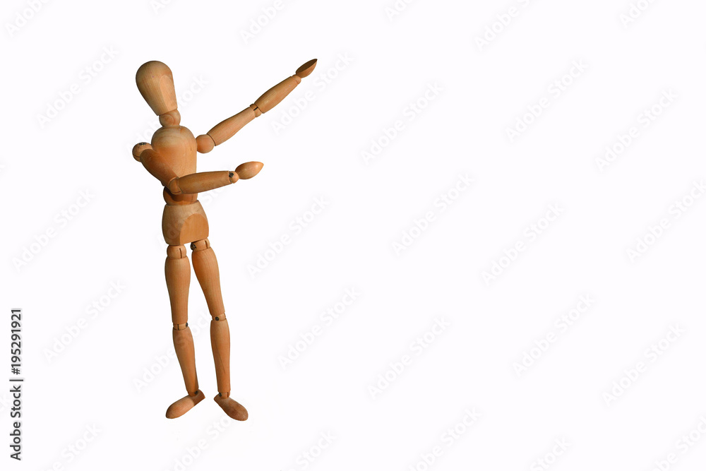 Wooden Artists Manikin pointing at copy space with white background Wooden Artists Manikin pointing at copy space with white background