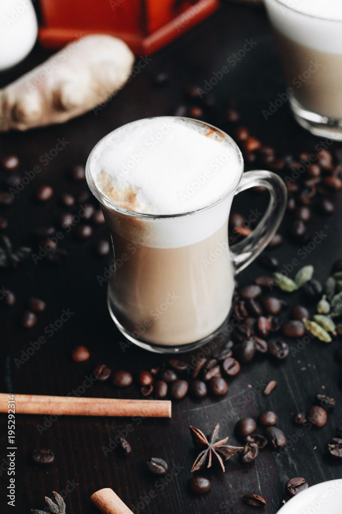 Cup of delicious latte coffee on black table