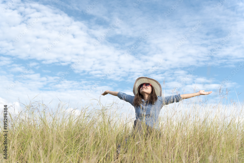 Happy woman jumping with air balloons on the meadow. Happy woman jumping with air balloons on the meadow.