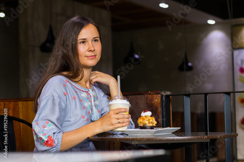 Woman waiting meeting with friends in cafe