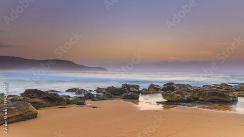 Hazy Dawn Seascape with Rocks