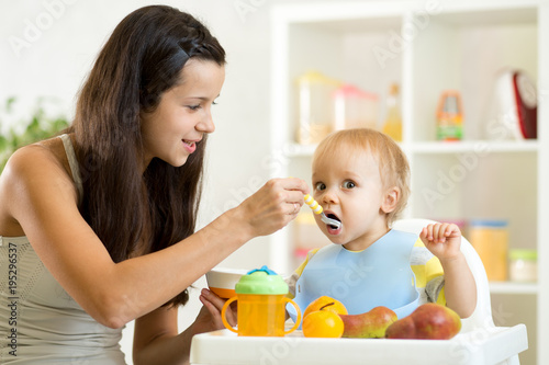 Mom giving homogenized food...