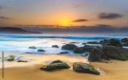 Hazy Sunrise Seascape with Rocks