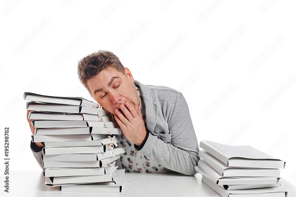 Sleeping businessman on table. Isolated on white background