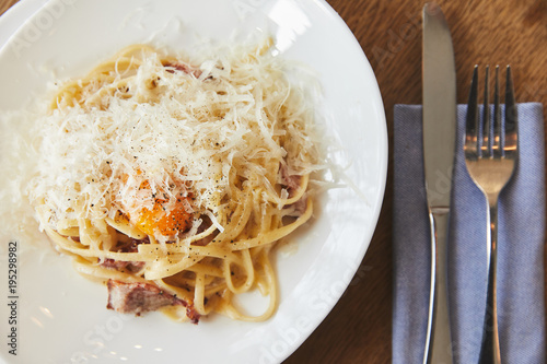 Spaghetti carbonara served in white plate