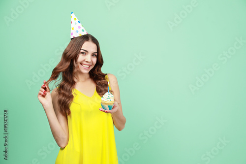 Happy young woman in party ...