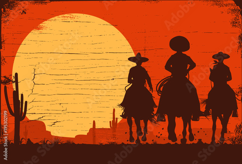 Silhouette of three Mexican cowboys riding horses on a wooden board