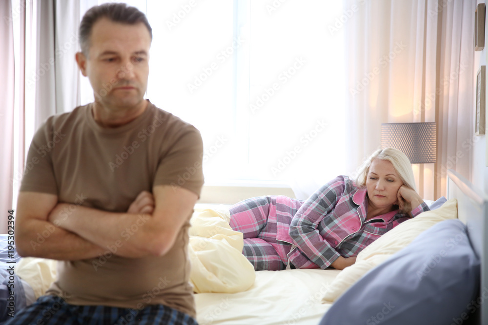 Senior couple with problem in relationship on bed Senior couple with problem in relationship on bed
