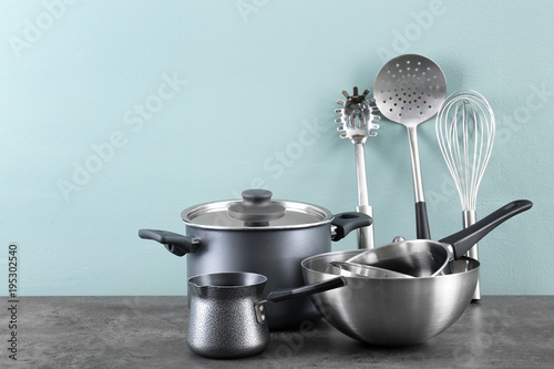 Metal cooking utensils on table photo