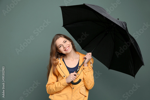 Young woman with black umbr...