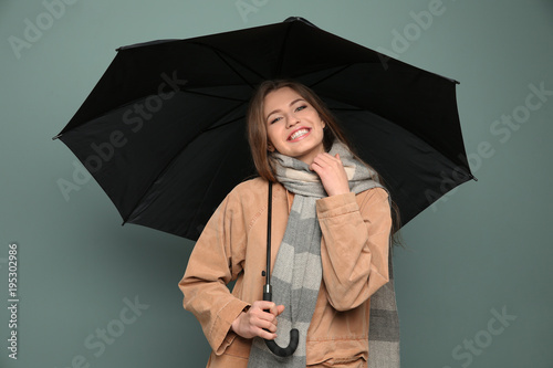 Young woman with black umbr...