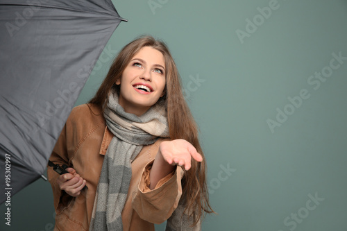 Young woman with black umbr...