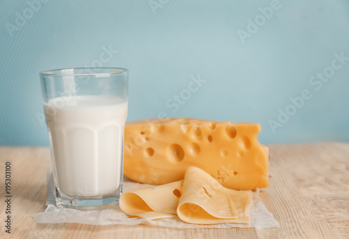 Glass of milk and cheese on table. Fresh dairy products
