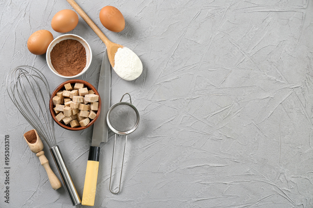 Set of kitchenware and products on grey background. Cooking master classes Set of kitchenware and products on grey background. Cooking master classes