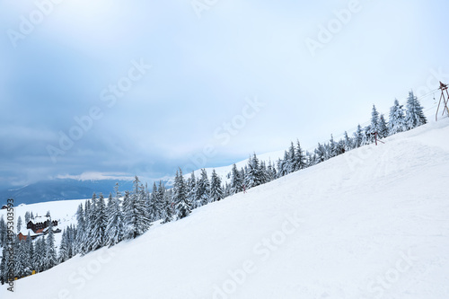 Beautiful mountain ski resort on snowy day. Winter vacation