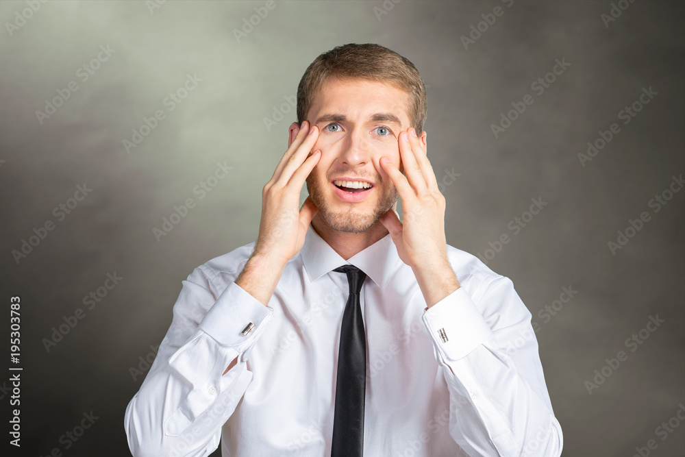 Scared and astonished young businessman Scared and astonished young businessman