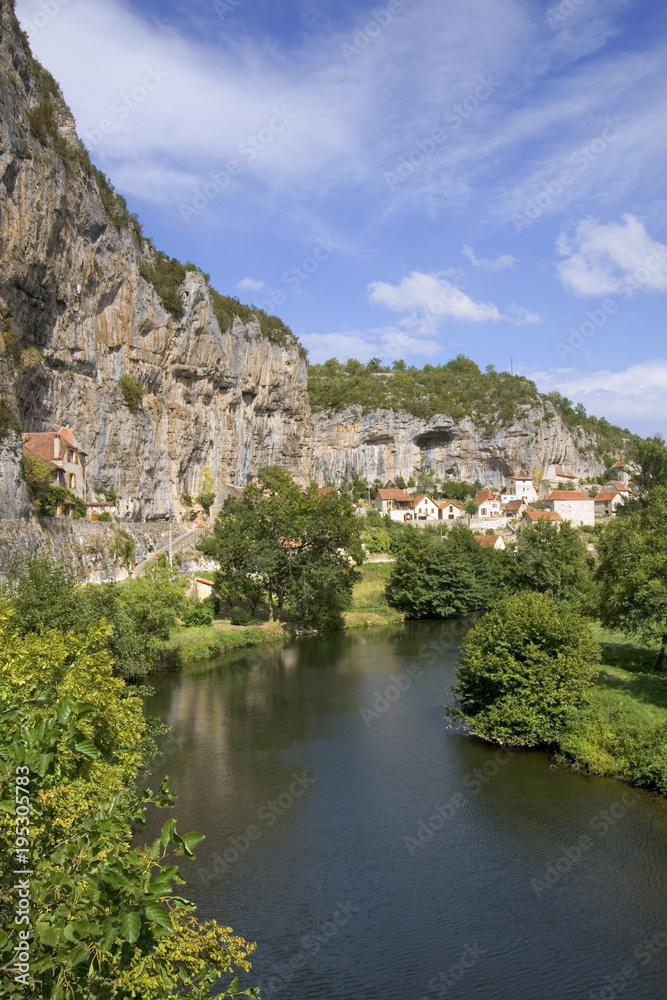 Europe, France, Quercy, Lot, Quaint village houses sit between the cliffs and the River Cele in Cabrerets