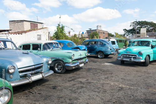 American classic cars parked in a parking in Santa Clara city. Cuba