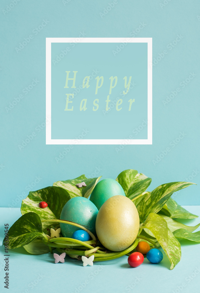 Easter eggs in nest from green leaves on a blue background. Happy Easter Inscription Easter eggs in nest from green leaves on a blue background. Happy Easter Inscription