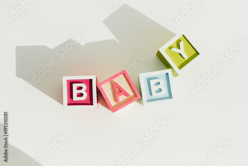 Top view of word baby on letter wooden blocks