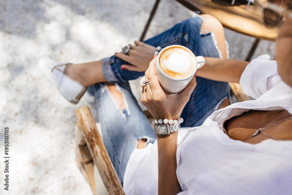 girl in a summer cafe drinking coffee for breakfast girl in a summer cafe drinking coffee for breakfast