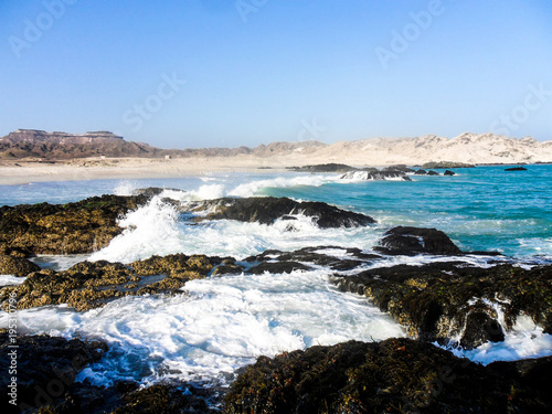 Water waves on the rocky beach © Hussain