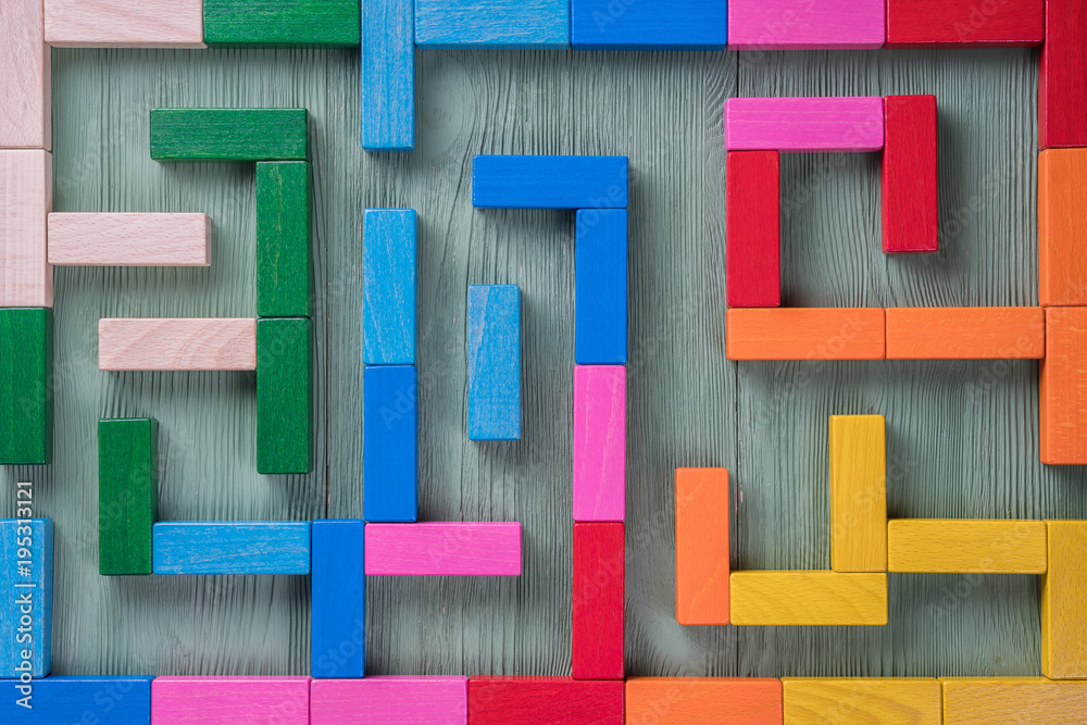 Fotografie Colorful maze on brown background