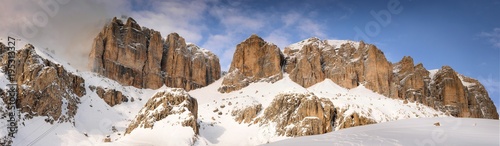 Panoramic landscape of the Sass Pordoi group in the Italian dolomites, as seen from Pass Pordoi. Canazei, Trento. Italy.