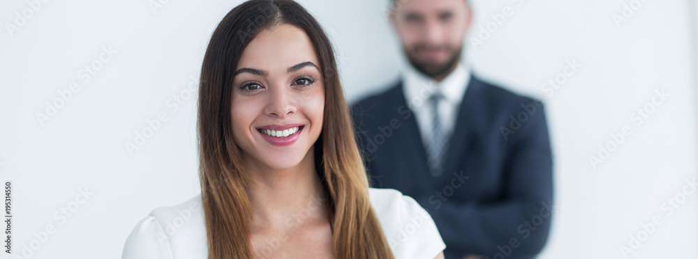 portrait of a business woman while the man is in the background portrait of a business woman while the man is in the background