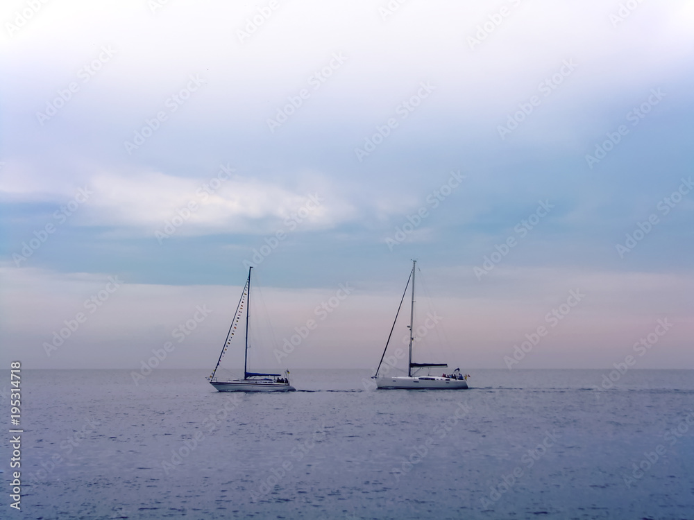 Yachts pair, pink romantic twilight