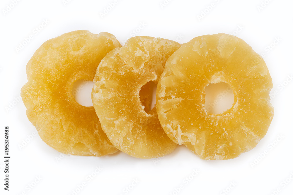 Dried and candied pineapple rings isolated on white background