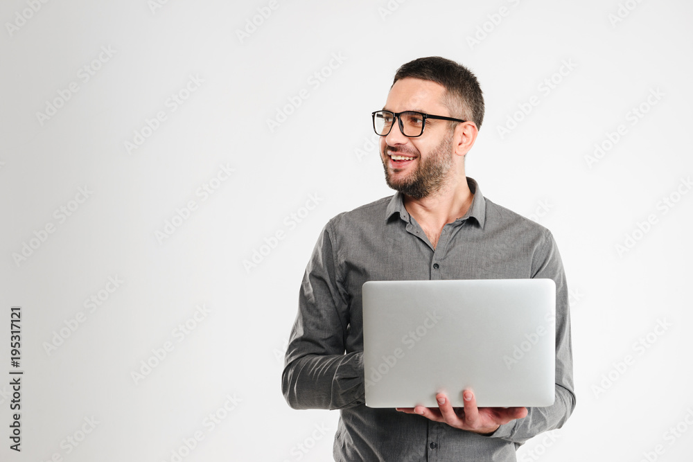 Concentrated businessman using laptop computer. Concentrated businessman using laptop computer.