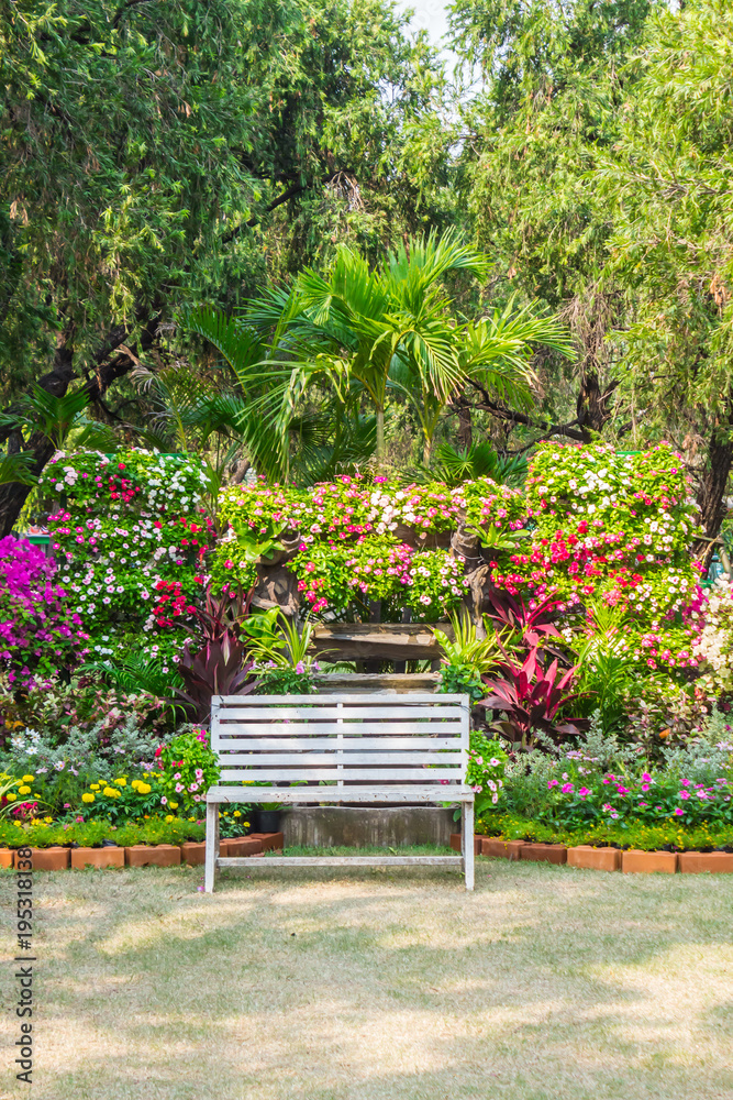 White chair in cozy flower garden./ White chair in cozy flower garden on summer.
White chair in cozy flower garden./ White chair in cozy flower garden on summer.