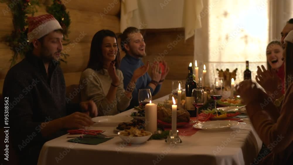 Young people having fun at Christmas dinner Young people having fun at Christmas dinner