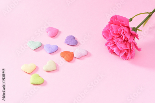 May Mother's Day Carnation Bunch of Flowers Bouquet with colorful heart shape stones Top View, Blank for Text, Pink