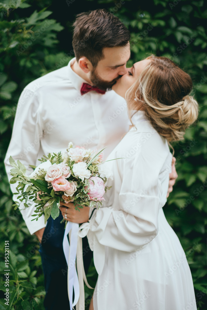 bride and groom walking in a beautiful garden. trees, Park bride and groom walking in a beautiful garden. trees, Park