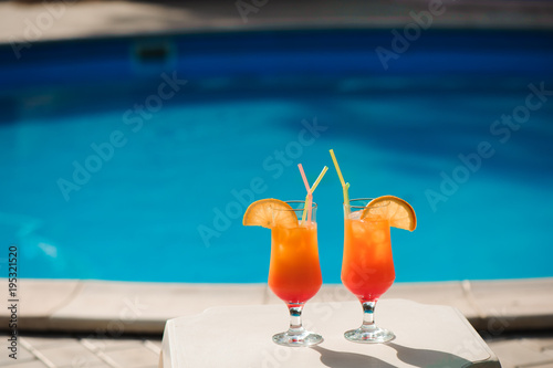 Cocktails on the background of the pool