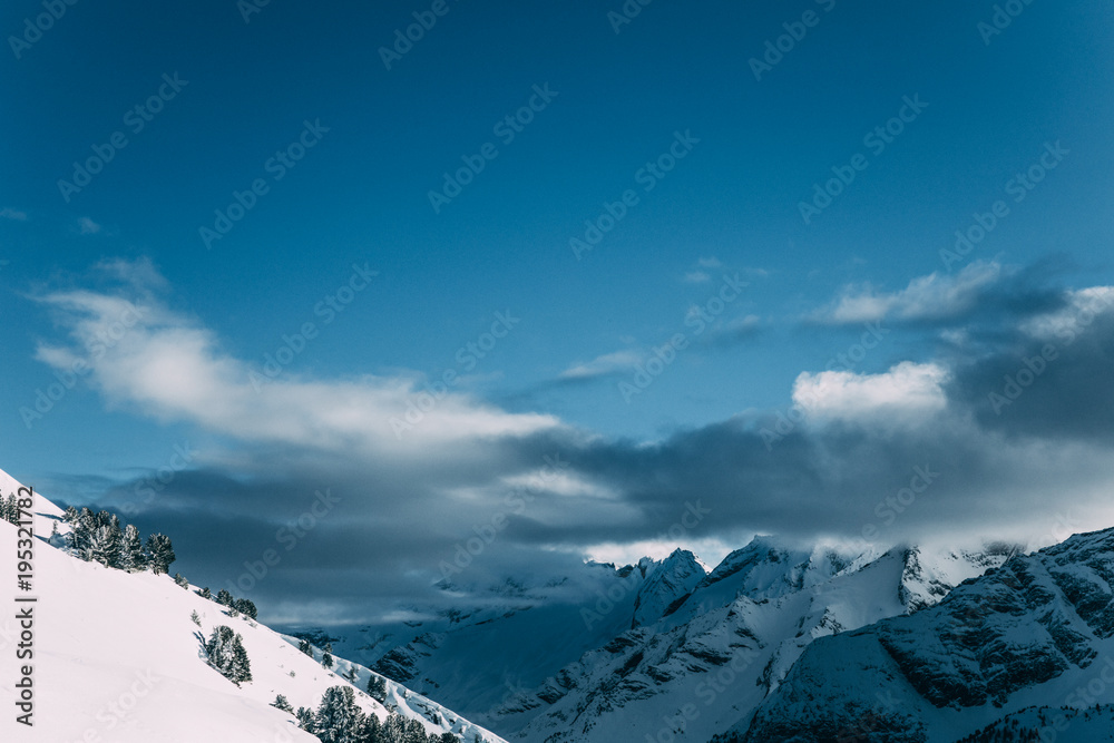 amazing snow-capped mountain peaks and cloudy sky, mayrhofen, austria