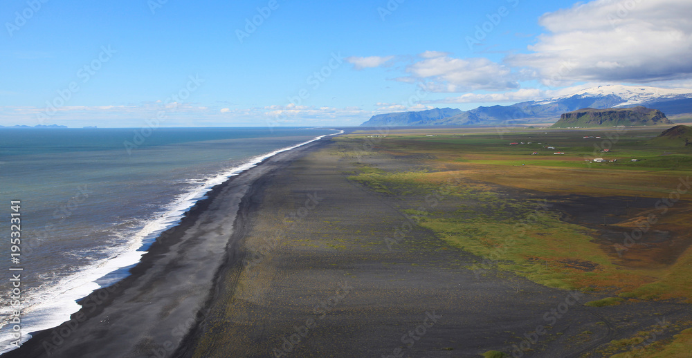 Sea coast near the Arch Dyrholaey in Iceland Sea coast near the Arch Dyrholaey in Iceland