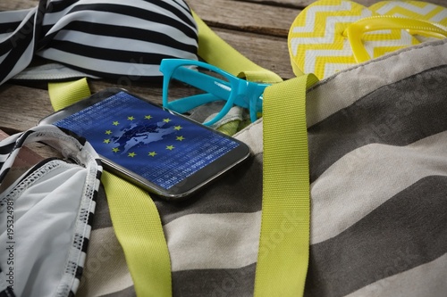 Composite image of vacation accessories on table photo