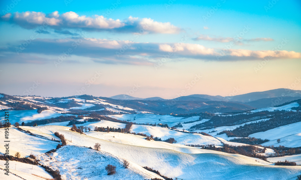 Snow in Tuscany, Radicondoli village, winter panorama. Siena, Italy