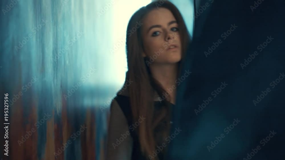 beautiful girl in Studio with a dark blue background beautiful girl in Studio with a dark blue background