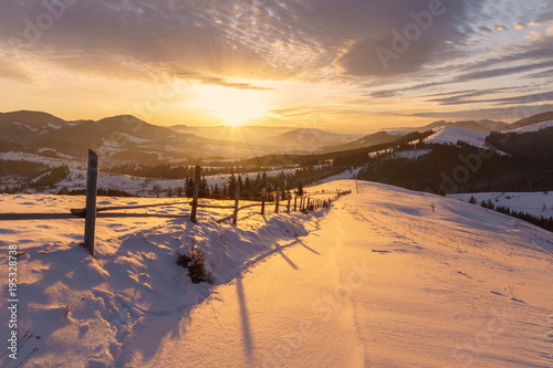 Winter sunrise in the hills mountains landscape.