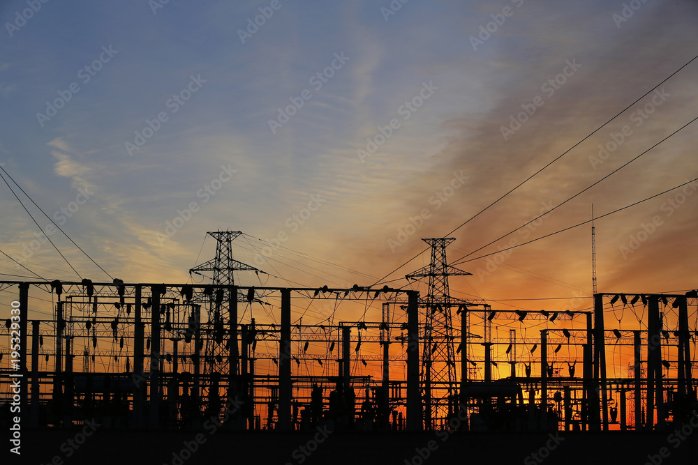 A high voltage substation in the sky at sunrise