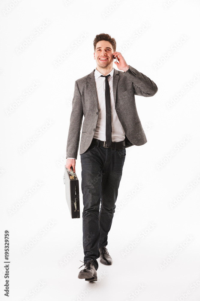 Full length portrait of a cheerful young businessman Full length portrait of a cheerful young businessman