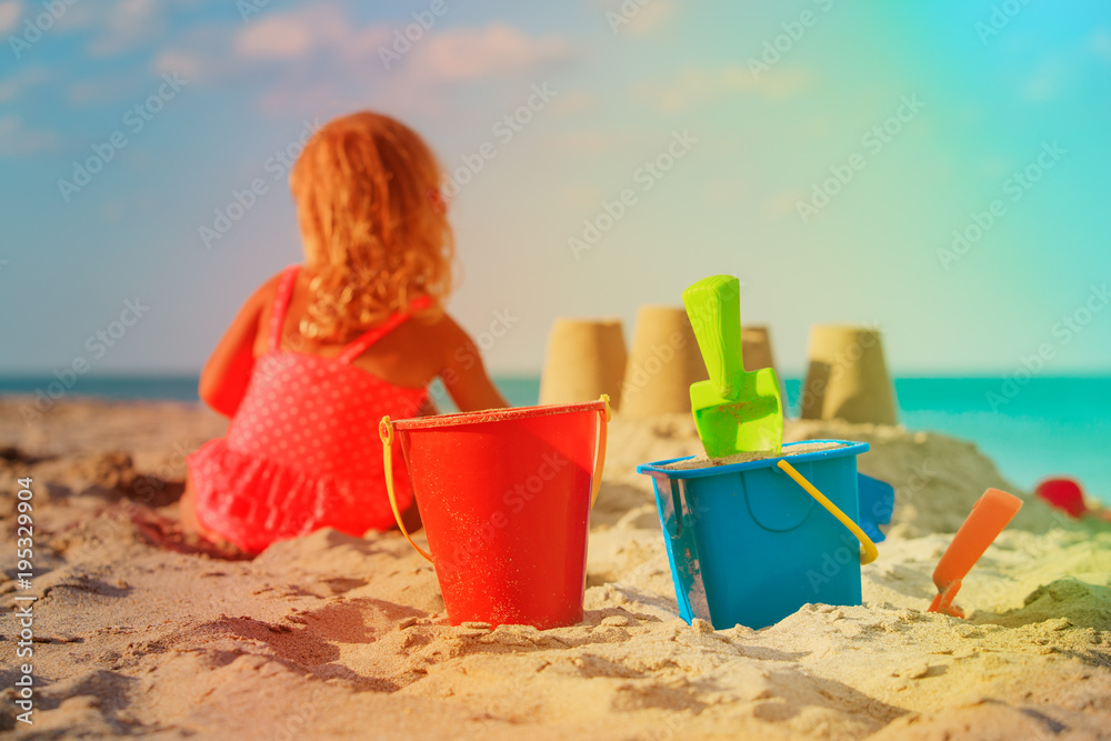 little girl play with sand on beach little girl play with sand on beach