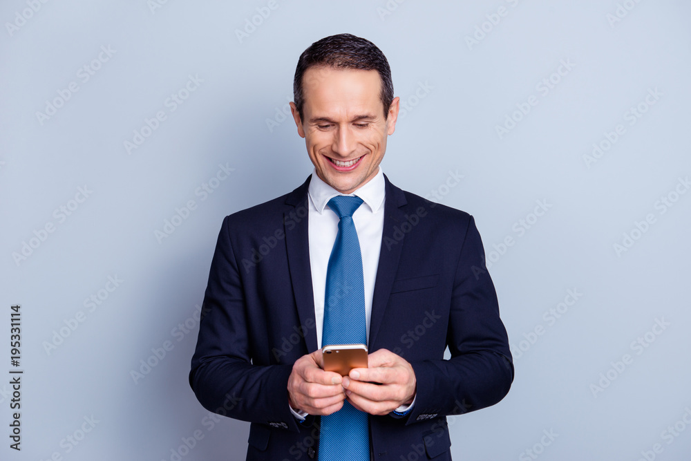 Pause break time modern people person entertainment concept. Portrait of excited careless handsome funky rejoicing employer using cell for watching videos isolated on gray background copy-space Pause break time modern people person entertainment concept. Portrait of excited careless handsome funky rejoicing employer using cell for watching videos isolated on gray background copy-space