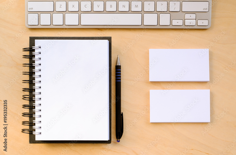 A notebook and a black pen on the desktop A notebook and a black pen on the desktop