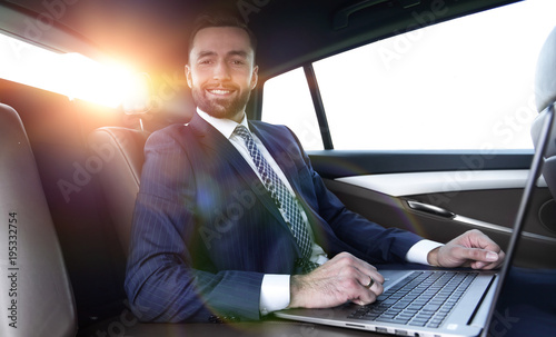 successful man working with laptop sitting in car © ASDF